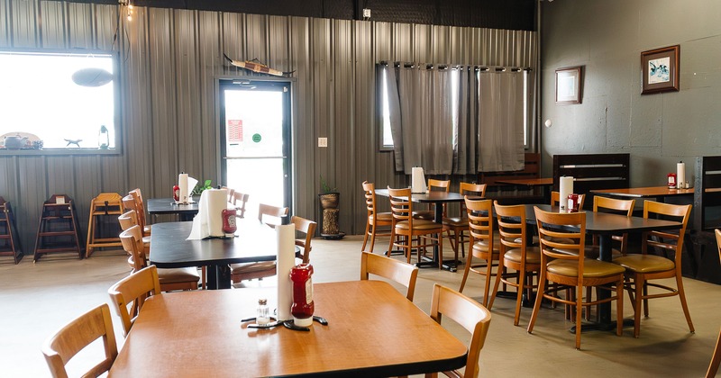 Cozy interior dining area with tables ready for guests