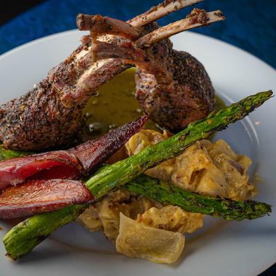 Rack of lamb with veggie sides.