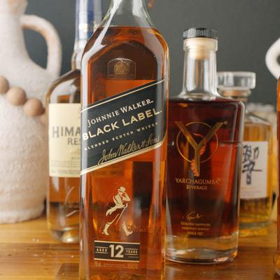 Assorted whisky bottles.