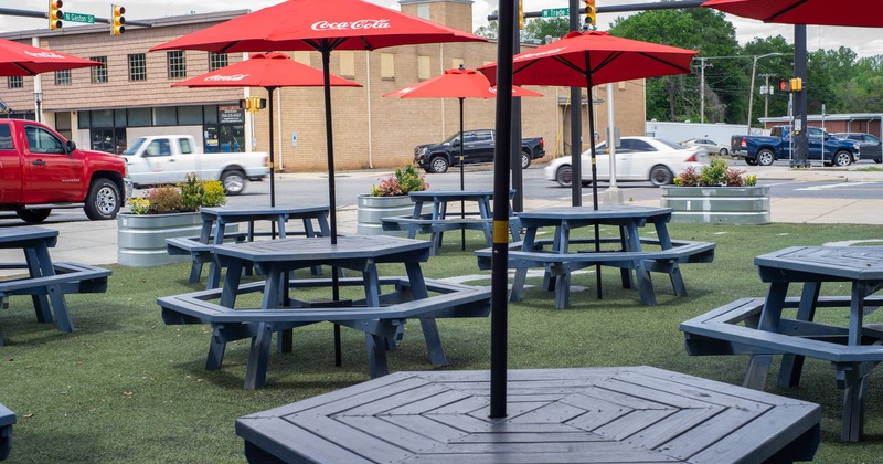 Exterior, tables with parasols and benches