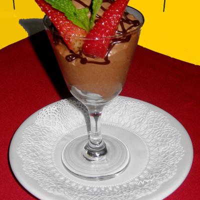 Chocolate mousse topped with strawberries.