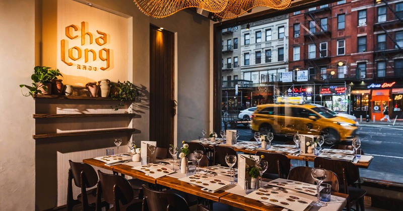 Interior, dining area, wooden tables with chairs, ready for guests, large shop window