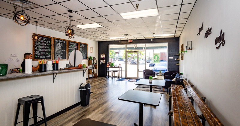 Interior, long wooden bench and tables near bar