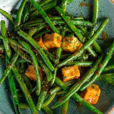 Fried green beans with tofu cubes, top view