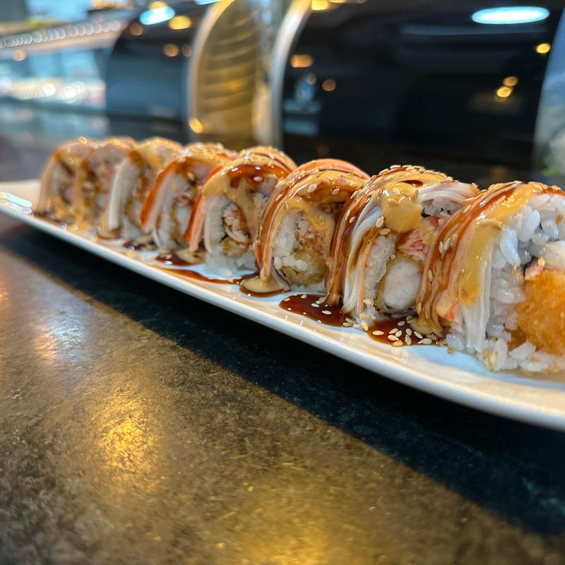 My lunch today! Treated myself to a Lover's roll (tuna, salmon, avocado on  a shrimp tempura and krab roll with eel sauce) and a Crunchy Dragon roll  (tuna and masago over a