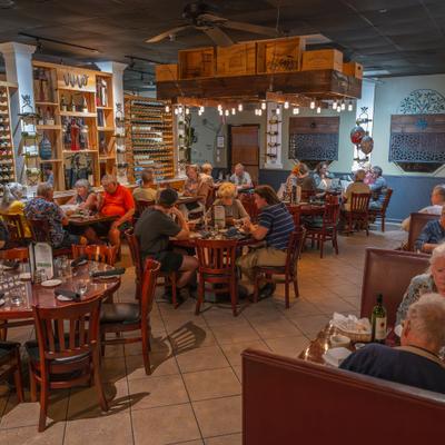 Interior, wide view, guests in a diner time.