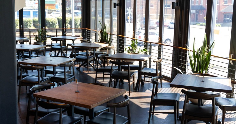 Interior, dining tables and seat by the windows