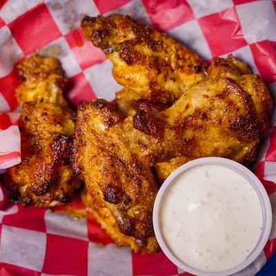 Chicken wings with a sauce.