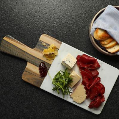 Charcuterie Board with cured meat and cheeses, honeycomb, jam, and toast.