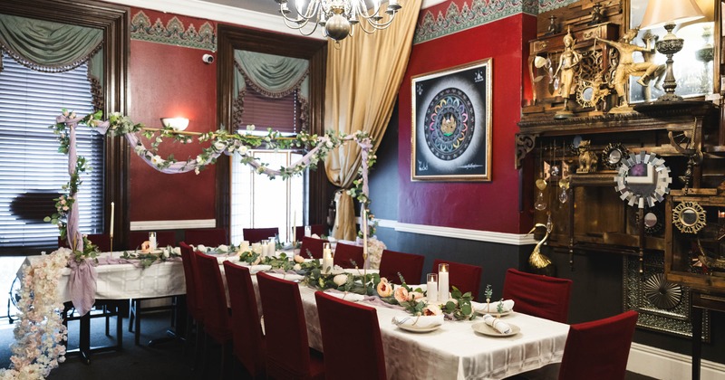 Elegant dining room with red walls and a chandelier