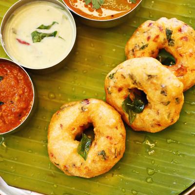 Indian deep-fried savory cabbage snacks, served with sauces.