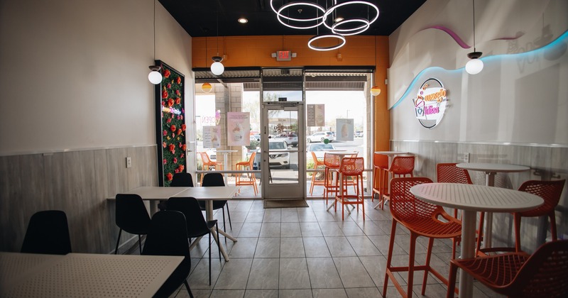 Interior with orange and black chairs