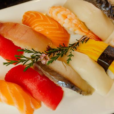 Sushi assortment arranged neatly on a plate.