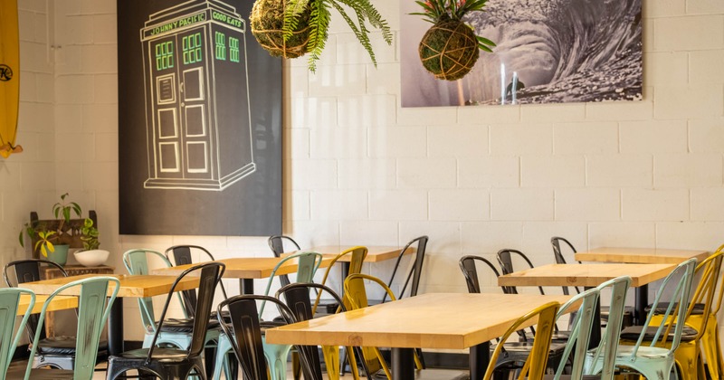Interior, dining area, tables for two, four and six with metal chairs