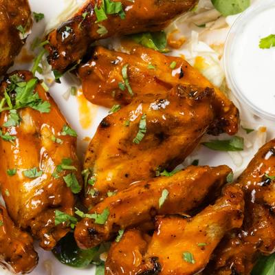 10 pieces chicken wings glazed with sauce and herbs.