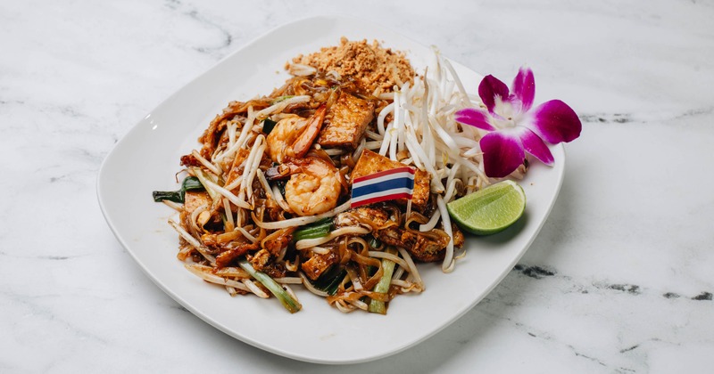 Pad Thai Shrimp with tofu, bean sprouts, groung peanuts and a flower garnish