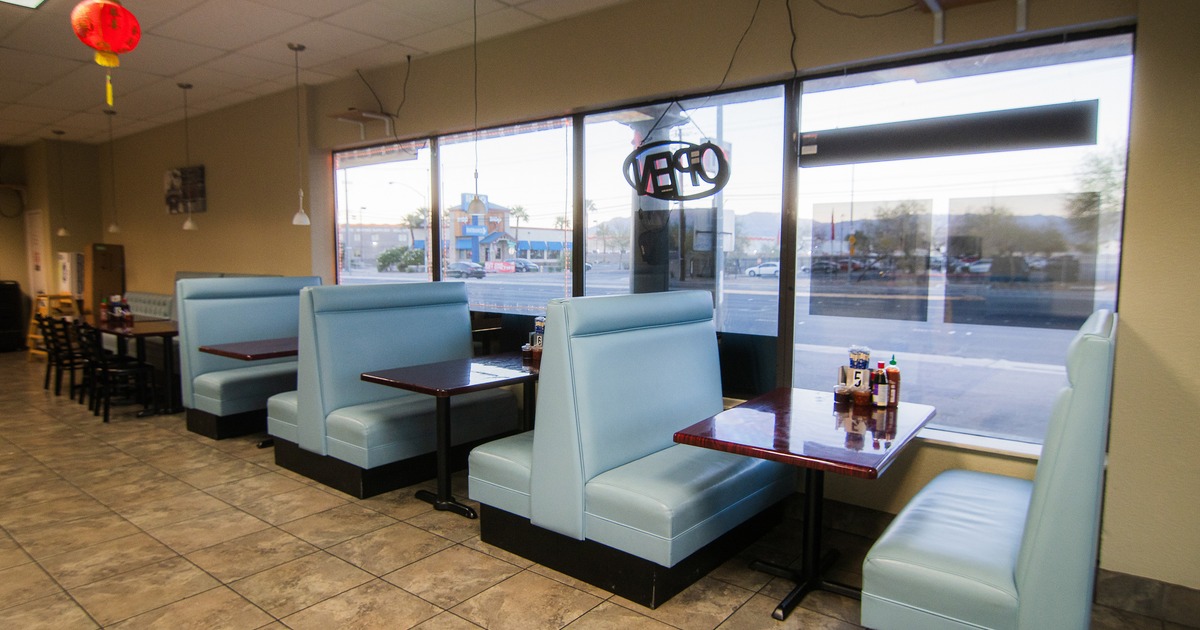 Interior space, dining area with upholstered booths lined up along windows