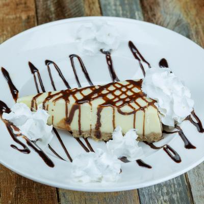 Classic creamy cheesecake with graham cracker crust.