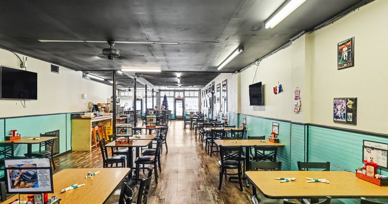 Interior, tables and chairs all lined up and ready for guests