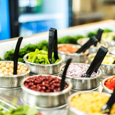 Various toppings in containers.