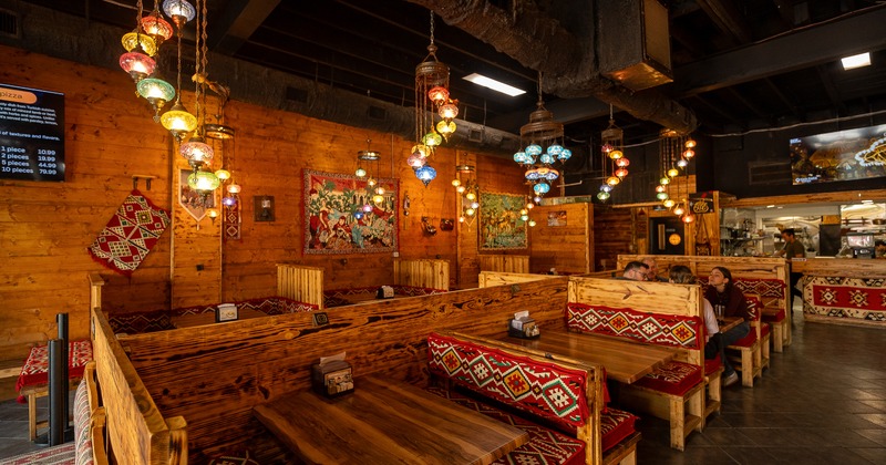 Interior, tables, benches, booths, carpets as decoration