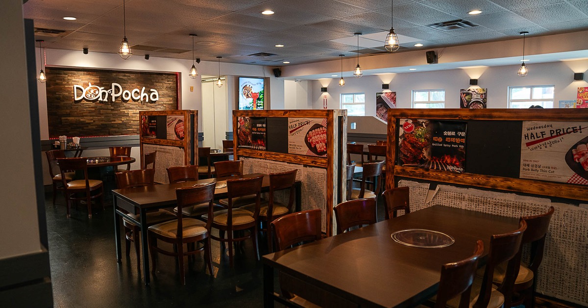 Interior, seating area with logo on the wall behind