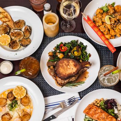 An assortment of food dishes and drinks on the table, top view.