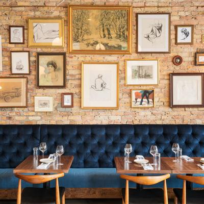 Interior, seating area, lots of framed pictures on the wall