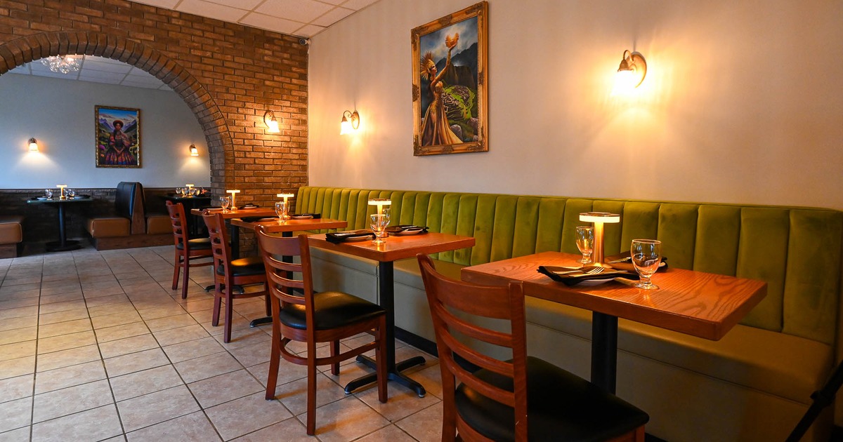 Interior, dining area with tables set for guests