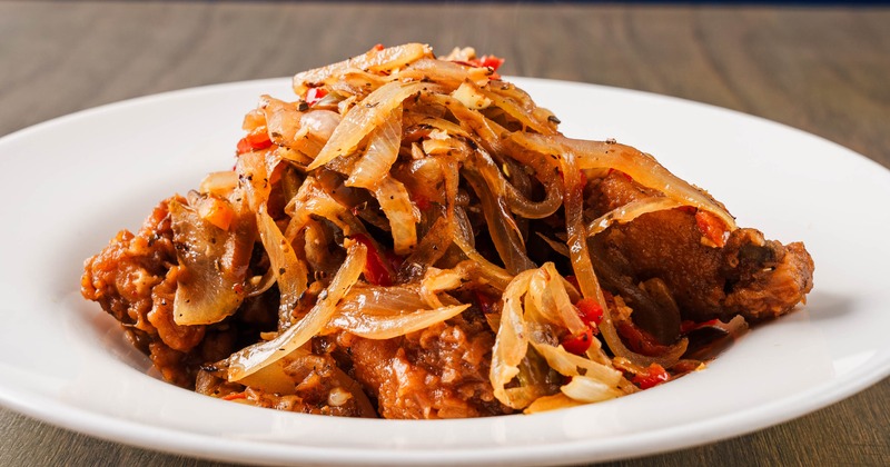 Chicken wings with cherry peppers and onions