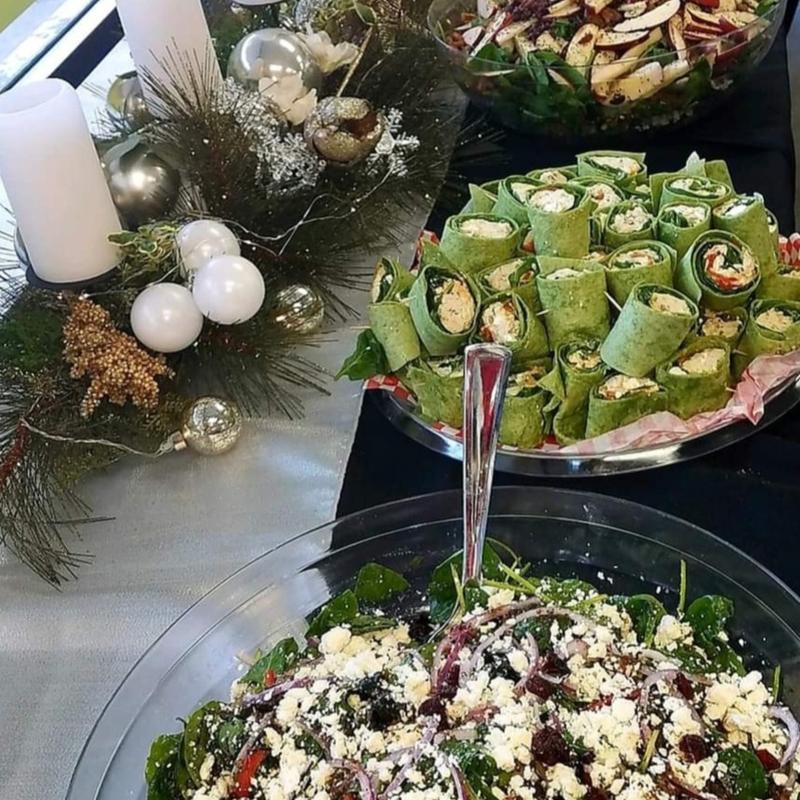 Combination Platter with Chicken Spinach Wrap, Watergate Fruit Salad, Apple Salad with Walnuts, and Mediterranean Salad with Feta Cheese. photo