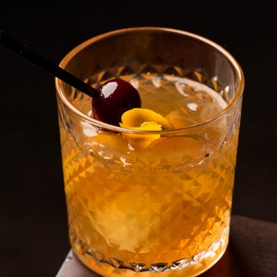 Chattanooga Bourbon whiskey, bitters, house-made simple syrup on a big cube, garnished with orange and cherry.