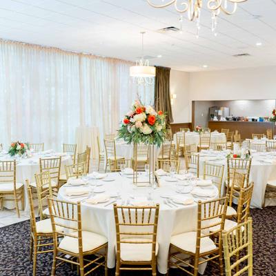 A table for a festive dinner decorated with a flower arrangement