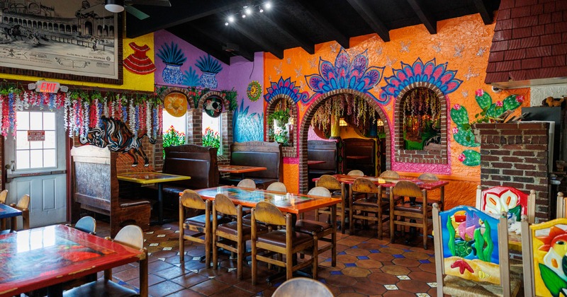 Interior, dining area, seating booths and regular tables, Mexican motif inspired decorations
