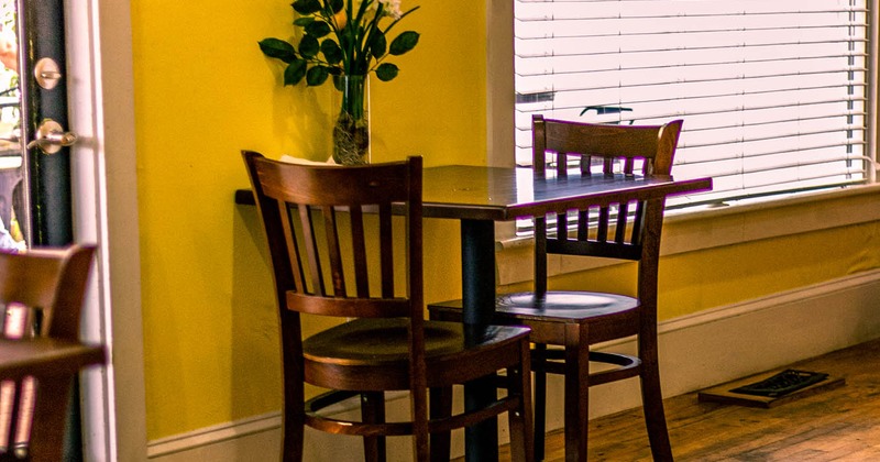 Interior, table for two decorated with flowers