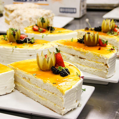 Slices of white and yellow cake on a catering table