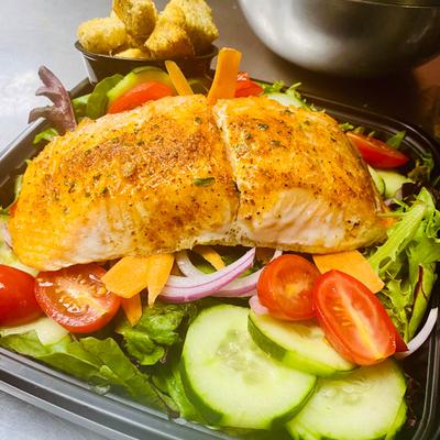 White fish salad with croutons on the side.
