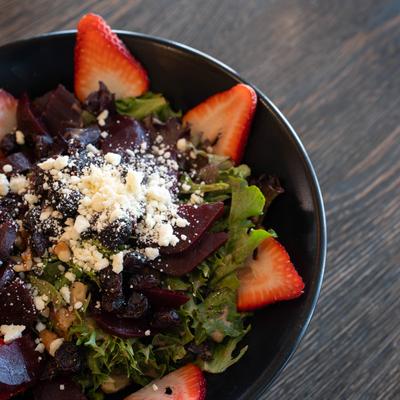 Beet salad with strawberries, dried cranberries, walnuts and feta cheese.