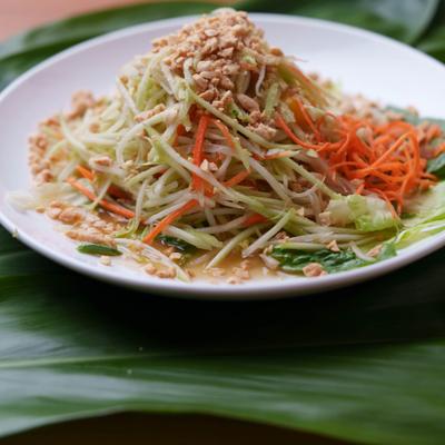 Green Papaya Salad topped with crushed peanuts.