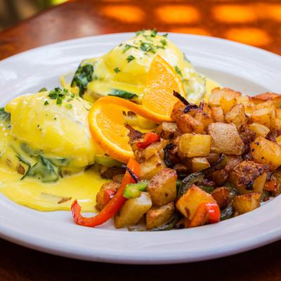 Garden Benedict with a side of house potatoes.