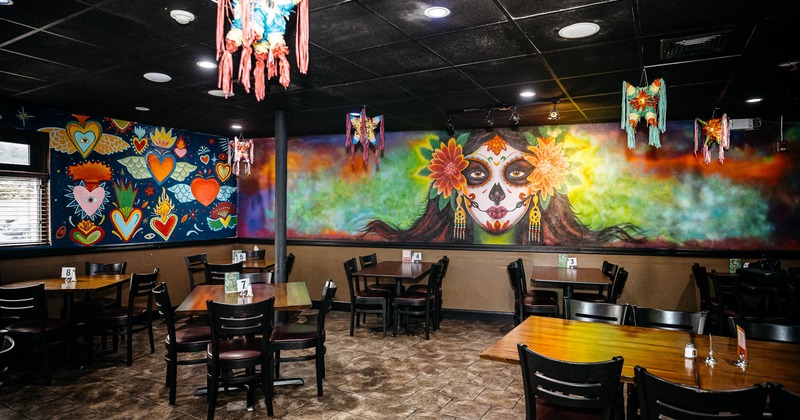 Dining area with mural on wall