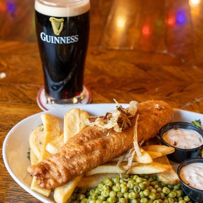 Fish & Chips, house made tartar sauce, peas, and a glass of Guinness.