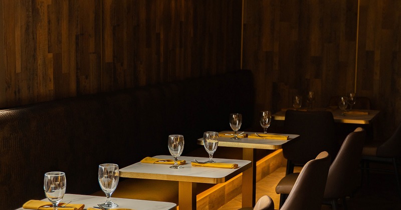 Small dining tables set for two guests