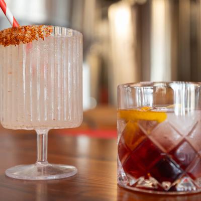 Two cocktails in textured glasses.