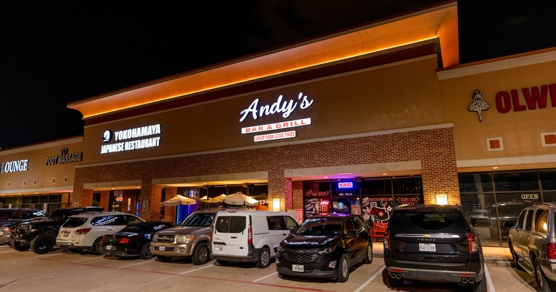 Exterior, front of the restaurant, parking, vehicles, corner view