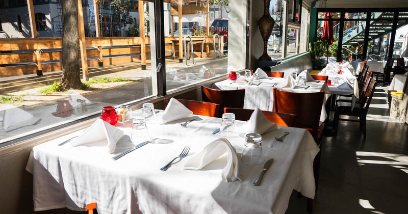 Set table for four people, area by the windows