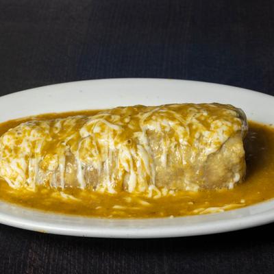 Burrito smothered in green salsa.