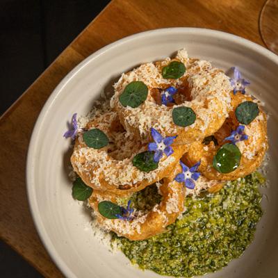 Shrimp HoneyTempura served over a green sauce.
