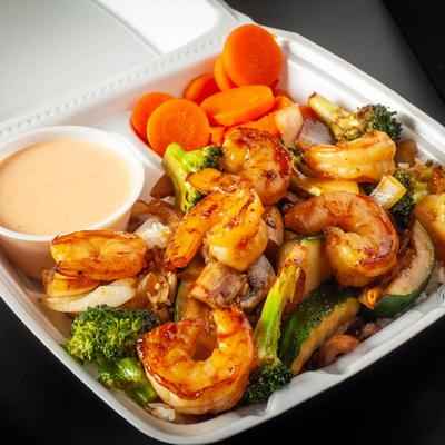 Shrimps and veggies with a side of sweet carrots and yaki sauce