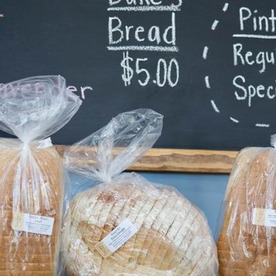Assorted local loafs - rustic sourdough, brioche, rye, whole wheat.